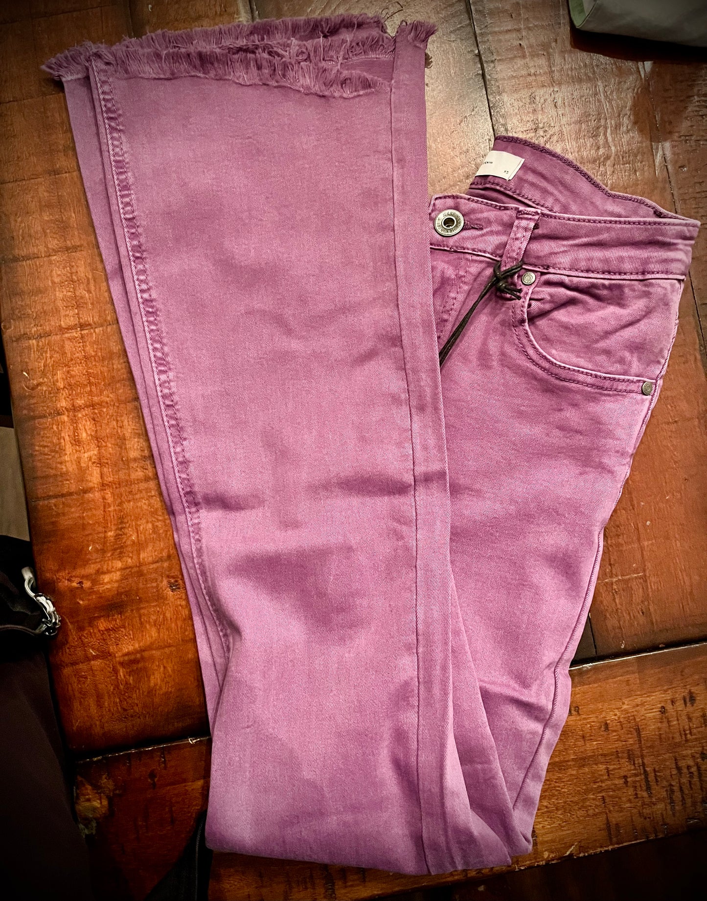 Purple Flare jeans with raw hem edge